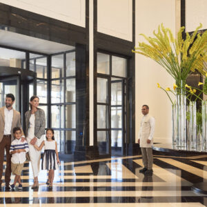 Family entering lobby